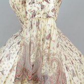 Dress, paisley-printed mull with fan-front bodice and tiered skirt, 1863, detail of sleeve