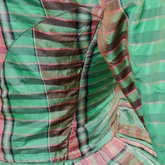 Dress, green, pink, and brown silk plaid, c. 1865, detail of side seam let out
