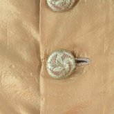 Dress, amber silk taffeta with chenille-fringed barege overdress, c. 1880, detail of underdress buttons