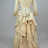 Dress, light gray silk faille with steel blue trim, 1870s, back view