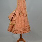 Girl’s dress, salmon and maroon silk taffeta check with bustle, 1880s, side view