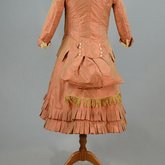 Girl’s dress, salmon and maroon silk taffeta check with bustle, 1880s, back view