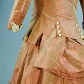 Girl’s dress, salmon and maroon silk taffeta check with bustle, 1880s, detail of bustle and cuff