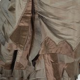 Dress, asymmetrical natural form brown silk taffeta and satin, c. 1880, detail of multiple trims