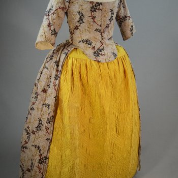 Quilted petticoat, yellow silk, 18th century, petticoat with dress, front view