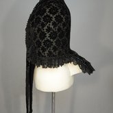 Mantelet with lappet tails in black voided velvet, 1880s, side view