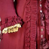 Housedress, cranberry red wool with self-trims, 1880s, detail of cuff and front