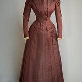 Wedding dress, maroon silk faille with sleeve puffs, 1893, front view