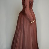 Wedding dress, maroon silk faille with sleeve puffs, 1893, side view