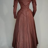 Wedding dress, maroon silk faille with sleeve puffs, 1893, back view