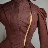 Wedding dress, maroon silk faille with sleeve puffs, 1893, bodice interior 1, unhooked collar and lapel