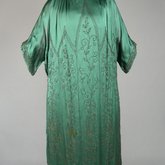 Dress, emerald green silk crepe with steel beads in Art Nouveau patterns, 1920s, front view