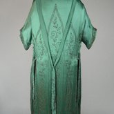 Dress, emerald green silk crepe with steel beads in Art Nouveau patterns, 1920s, back view