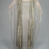 Dress, gray silk satin with a netted silver bead overlay and gray chiffon panels, 1921-1925, back view