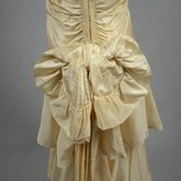 Dress, cream taffeta with a diagonal double-flounced skirt, 1928-1930, detail of bow