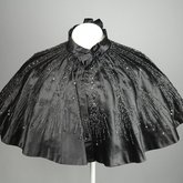 Cape, black silk satin with black bead embroidery, 1880s, front view