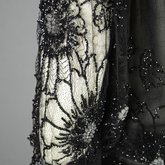 Dress, black silk chiffon with sequined allover lace, c. 1928, detail of sleeve