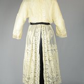 Dress, embroidered voile over a black silk satin skirt, 1910s, back view