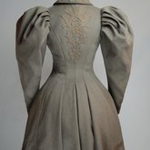 Coat, brown wool with leg-of-mutton sleeves and appliqué, 1894, back view