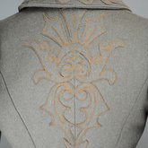 Coat, brown wool with leg-of-mutton sleeves and appliqué, 1894, detail of back appliqué
