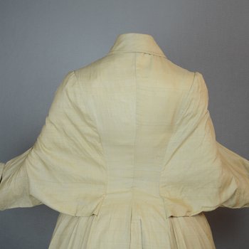 Duster, cream silk with dolman sleeves, 1880s, view with extended arms