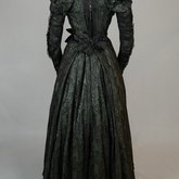Dress, black leaf-patterned silk over mint green cotton, c. 1898, back view