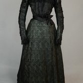 Dress, black leaf-patterned silk over mint green cotton, c. 1898, front view