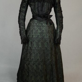 Dress, black leaf-patterned silk over mint green cotton, c. 1898, front view