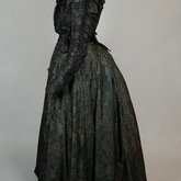 Dress, black leaf-patterned silk over mint green cotton, c. 1898, side view