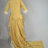 Dress, deep yellow silk taffeta with blue silk satin pleats and long train,1877-1882,  back view with seams let out
