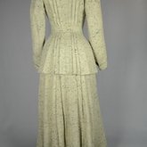 Suit, green tweed, with hip-length jacket and ankle-length skirt, c. 1912, back view