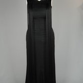 Evening gown, sleeveless, pin-tucked black crepe with long black cord tassels, 1930s, front view