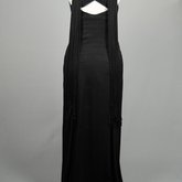 Evening gown, sleeveless, pin-tucked black crepe with long black cord tassels, 1930s, back view