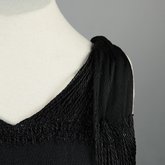 Evening gown, sleeveless, pin-tucked black crepe with long black cord tassels, 1930s, detail of cord neckline