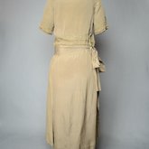 Dress, taupe silk crepe with short sleeves and overskirt embroidered with cord and gold beads, c. 1920, back view