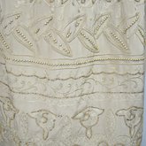 Dress, taupe silk crepe with short sleeves and overskirt embroidered with cord and gold beads, c. 1920, detail of skirt panel