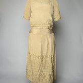 Dress, taupe silk crepe with short sleeves and overskirt embroidered with cord and gold beads, c. 1920, front view