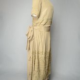 Dress, taupe silk crepe with short sleeves and overskirt embroidered with cord and gold beads, c. 1920, quarter view