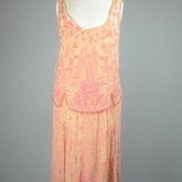 Sheath dress, sleeveless with irregular hem, apricot chiffon with pink and coral beads, c. 1925, front view