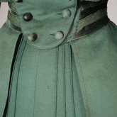 Suit, green wool with braid and velvet, c. 1906, detail of skirt darts and waist buttons