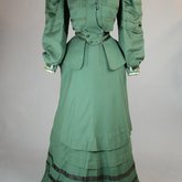 Suit, green wool with braid and velvet, c. 1906, front view