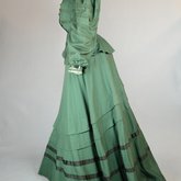 Suit, green wool with braid and velvet, c. 1906, side view