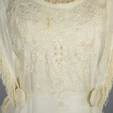 Dress, white silk with embroidery and fringe, 1910s, detail of bodice embroidery