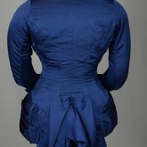 Bodice, blue silk faille with silk velvet panel and pleated peplum, 1890-1892, back view