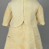 Boy’s dress and vest, white cotton piqué decorated with a leaf and loop braid pattern, 1900-1917, front view