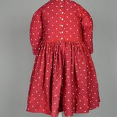 Boy’s dress, wool challis printed red, with white polka dots, c. 1897, back view