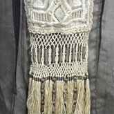 Dress, cream satin with black chiffon overlay and tasseled, embroidered panels, c. 1910s (refurbished), detail of skirt panel