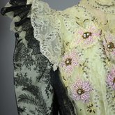 Bodice, black lace over green faille and pale green organdy with shoulder frills, pink beaded flowers, and sequins, c. 1898, detail of shoulder frill and bodice embellishments