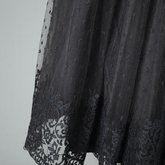 Cocktail dress, black point d’esprit with lace over black rayon lining, 1950s, detail of skirt