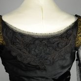 Dress, black silk satin and point d’esprit bobbinet with organdy and cord appliqué, c. 1915-1918, detail of back neckline